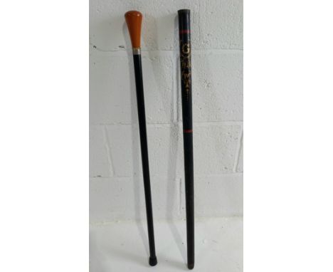 A Goerge IV painted police night stick, bears initials W R, and a amber coloured knob walking cane. 