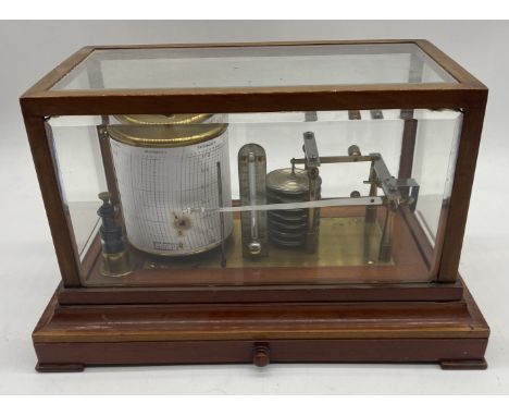 An un-named turn of the century Barograph with 7 bellow stack in mahogany glazed case with drawer below for charts