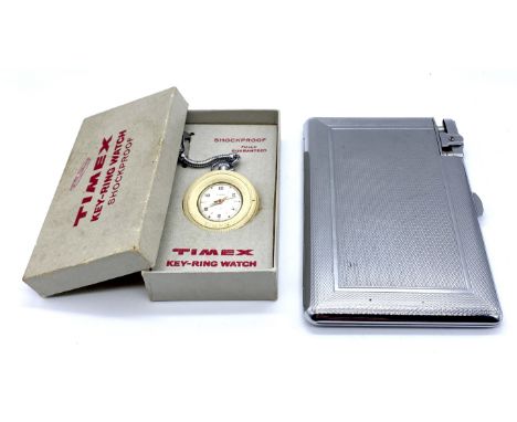 A vintage boxed Timex key-ring watch along with a boxed "Mosda 500" chromed cigarette case with integral lighter