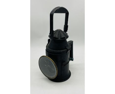 A vintage Indian Railway signal lamp marked with  H.A.G.T.F. Bombay
