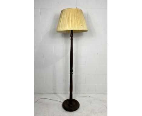 A vintage oak standard lamp with shade