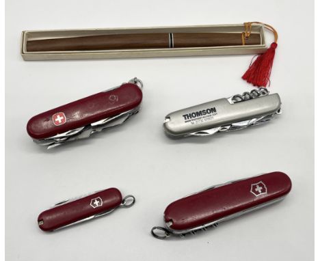 A small collection of pocket knives including Swiss Army 