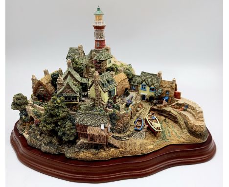 A large Lilliput Lane collectors' cottage model "Out of The Storm" depicting a harbour scene (Number 1800 in a limited editio