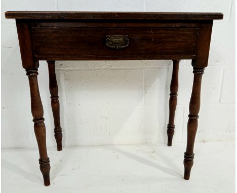 A vintage oak side table with single frieze drawer, on turned supports, 76cm wide, 45cm deep, 74cm high.