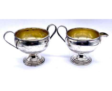 A vintage sterling silver twin handled sugar basin and matching cream jug, total weight 185g