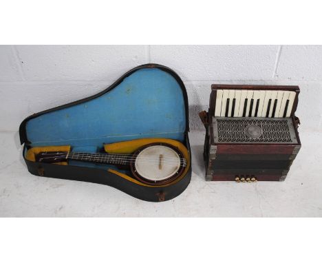 A vintage Antoria accordion, along with a cased banjolele 