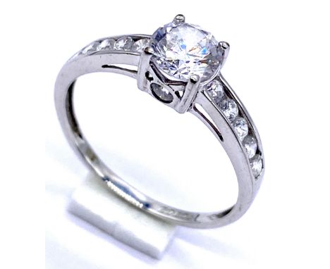 A 9ct white gold dress ring set with cubic zirconia, size Q