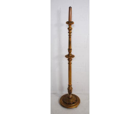 A gilded standard lamp, with carved and fluted detailing - height 156cm