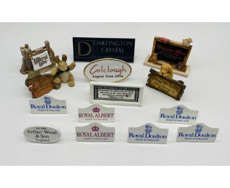 A collection of point of sale shop name plates including Royal Doulton, Royal Albert, Lilliput Lane, Colclough, Paw Prints, P