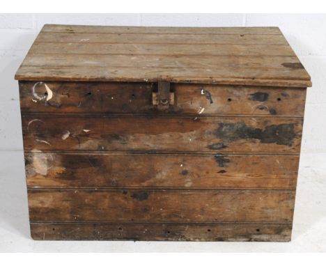 An antique pine trunk, with wrought iron handles - length 96cm, depth 68cm, height 64cm