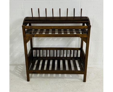 A vintage oak rack possibly from a mill used for bobbin storage, 95cm wide, 47cm deep, 108cm high.