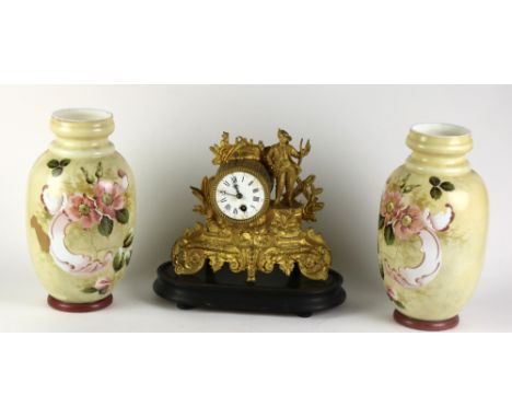 A 19th Century French ormolu Mantle Clock, decorated with young boy holding pitch fork, and embellished with flower under gla