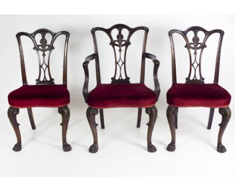 An attractive set of 8 carved mahogany Dining Chairs, (6 + 2 carvers) in the Chippendale style with the carved splat backs de