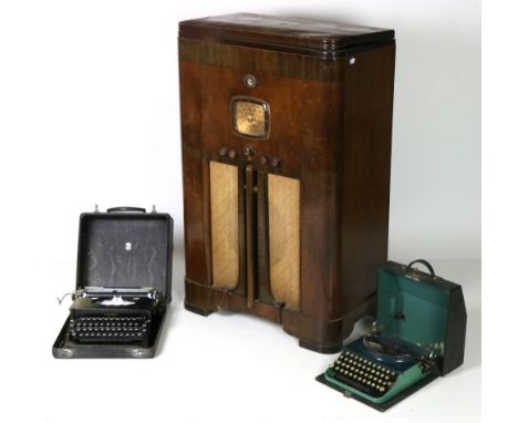 Two Vintage Typewriters, a Corona silent and a Remington, both cased; together with an Emerson upright mahogany Radio. (3)Pro