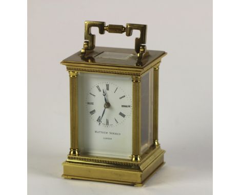 An attractive and heavy early 20th Century Swiss brass Carriage Clock, decorated in Roman taste, with egg and dart moulding a