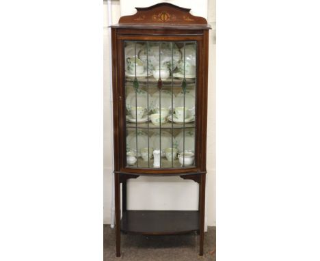 An Edwardian inlaid dome fronted Display Cabinet, of small proportions, the glazed door with stained glass insets, on a shelf