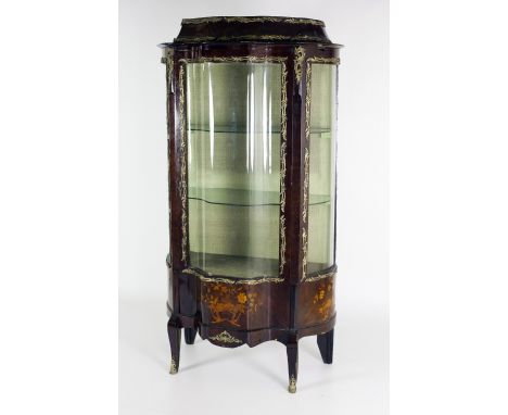 An attractive kingswood marquetry and ormolu mounted Vitrine, with bombe shaped glazed doors and sides, on a base with centra