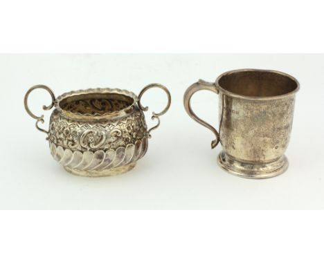 A small Victorian English silver two handled Sugar Bowl, of oval shape with embossed and reeded body, Birmingham c. 1889, by 