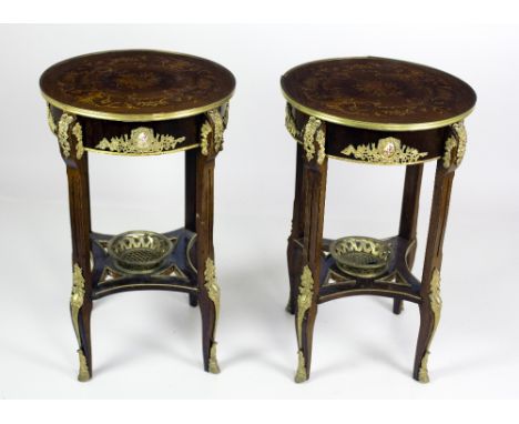 An attractive pair of French style marquetry and ormolu mounted circular Tables, the profusely inlaid top over aprons with de