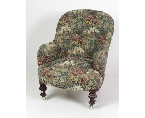 An attractive Victorian mahogany Tub Armchair, upholstered in tapestry fabric on front turned legs. (1)Provenance: Martin Fam