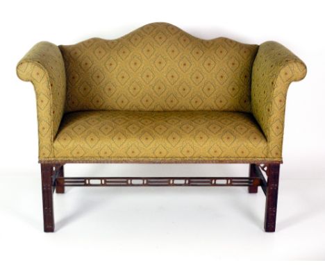 An unusual small mahogany Chippendale style two seater Settee, covered in attractive gold ground moquette with diamond design