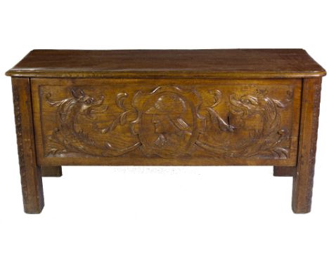 A late 18th / early 19th Century oak carved Coffer, possibly Spanish, the lift top with original hinges, with a front frieze 