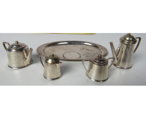 A miniature Birmingham silver Tea Service, teapot, coffee pot, sugar and cream, all with lids, and a matching oval Tray. (5)