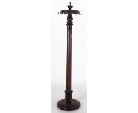 A 19th Century Irish mahogany pillar Hat and Coat Stand, with shaped finial top on a plain pillar support with stepped circul