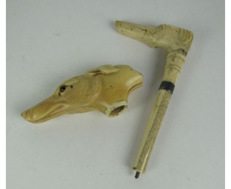 A 19th Century carved and engraved ivory Cane Handle, in the shape of a hounds head, with one glass eye only; and a smaller d