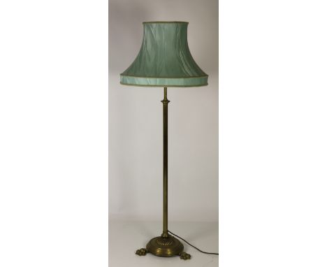 An Edwardian telescopic brass Standard Lamp, on heavy circular base with paw feet, and with turquoise coloured shade. (1)