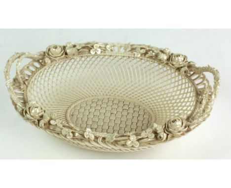 An important First Period Belleek cream ware flower encrusted and pierced basket design oval Bowl. (1)