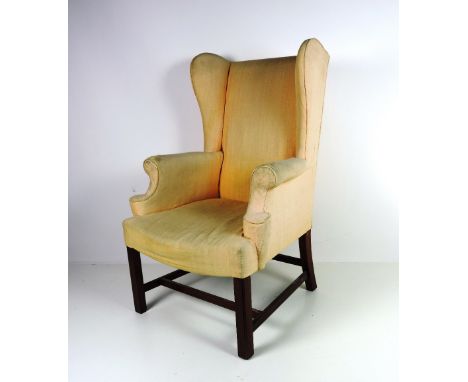 A Chippendale style upholstered mahogany Wing-back Armchair. (1)