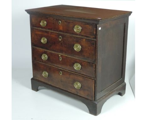 An early 18th Century walnut Chest of four drawers, each with crossbanded rim, with panel sides on bracket feet, (oak top lat