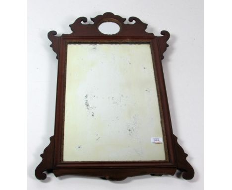 A Georgian period mahogany Wall Mirror, with shaped top and inset small circular mirror plate, above a large panel, approx. 8