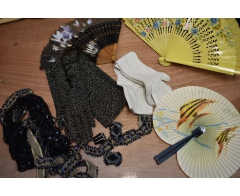 A mixed box of vintage and antique beaded sections,an art deco buckle, three fans and two pairs of gloves.