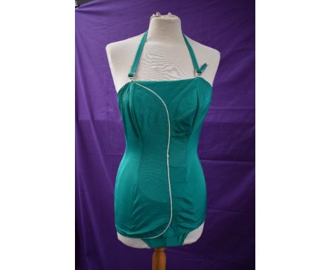 A collectable Janet Dickinson model emerald green 1950s halter neck swim suit with white piping, boned bodice,back metal zip 