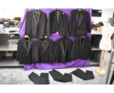 A large lot of gents good quality evening jackets and trousers,some with button fly, various eras and sizes.