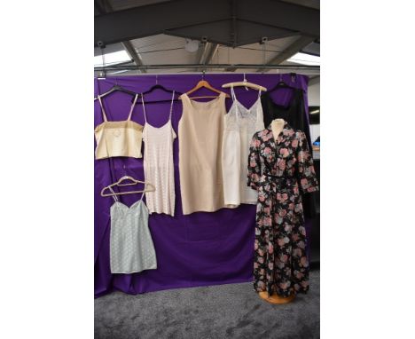 A collection of vintage lingerie and nightwear including 1940s housecoat,five slips/petticoats ranging from 1930s up to 1960s