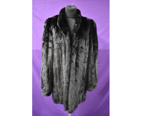 A mid length vintage black mink coat.