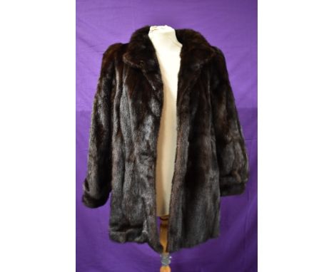 A mid length vintage dark brown mink coat having Continental furs,Blackpool label.