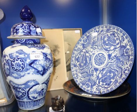 A JAPANESE PRINT OF AN EGRET and another (unframed), an oriental blue and white plate, another similar, a blue and white Orie