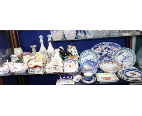 A POOLE POTTERY DOLPHIN, a collection of ceramic cottage electric lamps and mixed ceramics (two shelves)