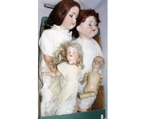 A LARGE ARMAND MARSEILLE DOLL with a ceramic head and composite body, 62 cm high (overall) and three similar (4)