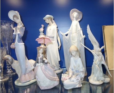 LLADRO: A GIRL WITH AN UMBRELLA, 23 cm high, a woman in a long gown, 36 cm high, similar figures and a Nao study (6)