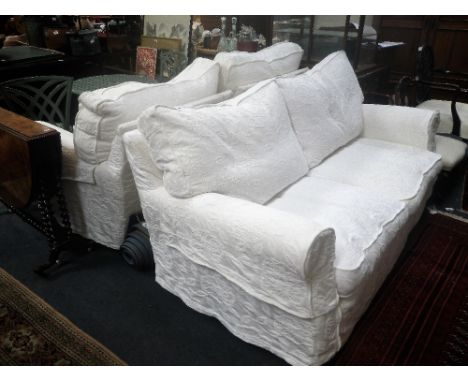 A MODERN THREE PIECE SUITE of traditional design with cream calico upholstery with white loose covers, the sofa, 195 cm wide