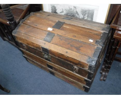 A 19TH CENTURY METAL BOUND TRAVELLING TRUNK