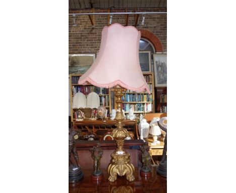 A LARGE GILTWOOD TABLE LAMP in the form of an altar candlestick, 76 cm high (plus fitting)