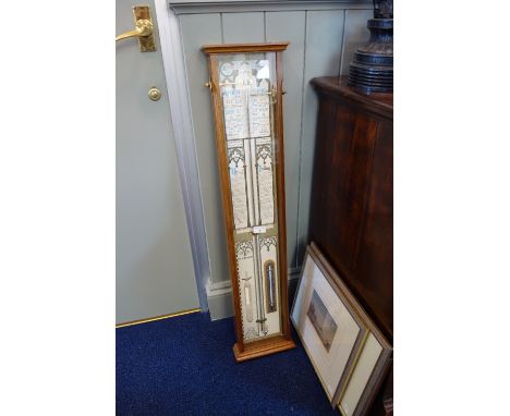 A REPRODUCTION "ADMIRAL FITZROY'S BAROMETER" in an oak case, 97 cm high