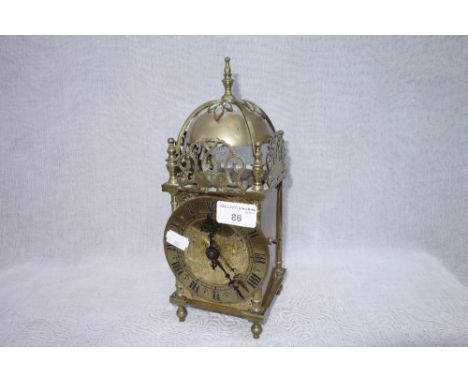 A BRASS LANTERN CLOCK, 27 cm high