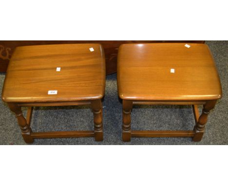 A pair of Ercol golden oak occasional tables